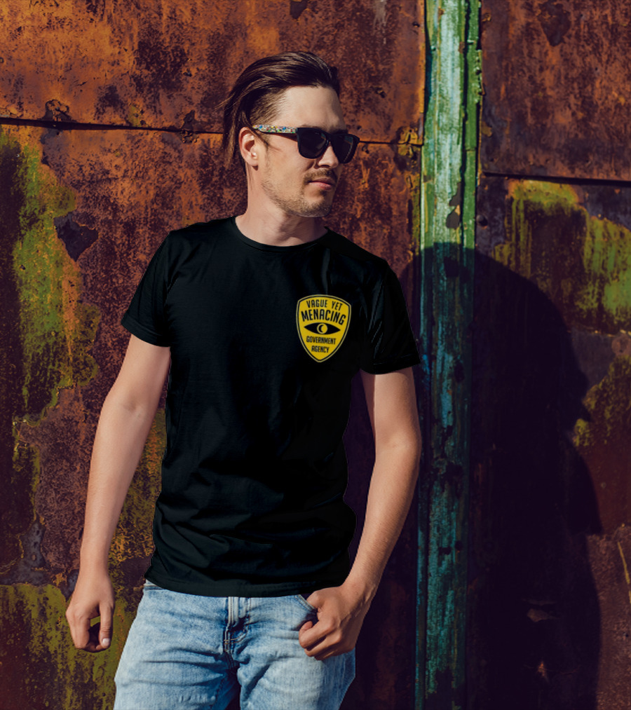 Vague Yet Menacing Government Agency Yellow Badge With Eye T-Shirt