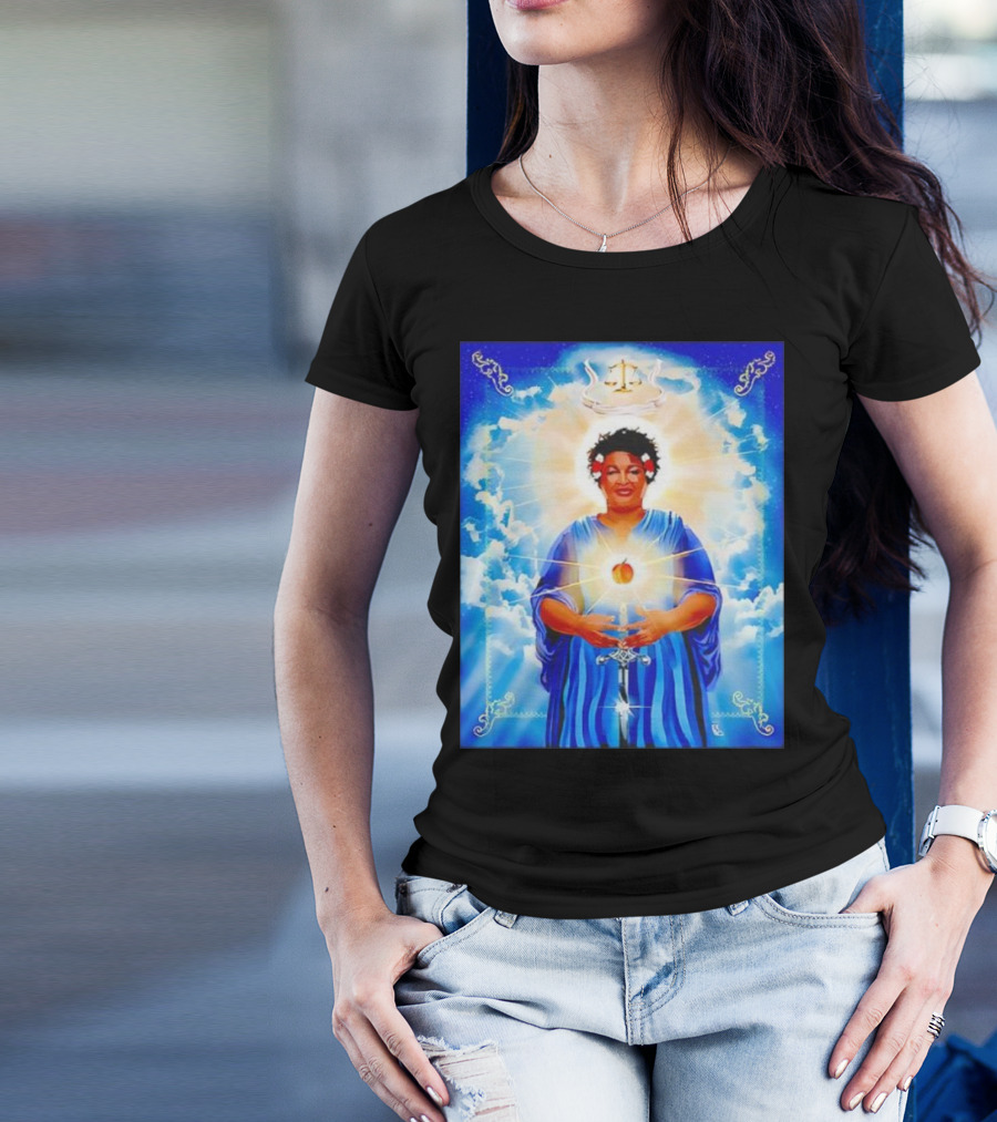 Stacey Abrams Patron Saint Of Fairness In Voting With Scales Of Justice Halo And Glowing Apple In Celestial Clouds T-Shirt