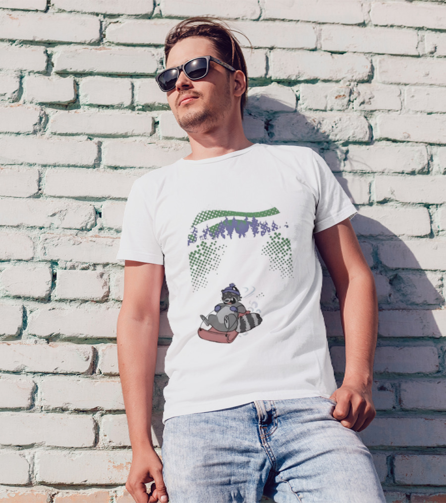Raccoon Sledding In Winter Forest Scene With Evergreen Trees And Snowflakes T-Shirt