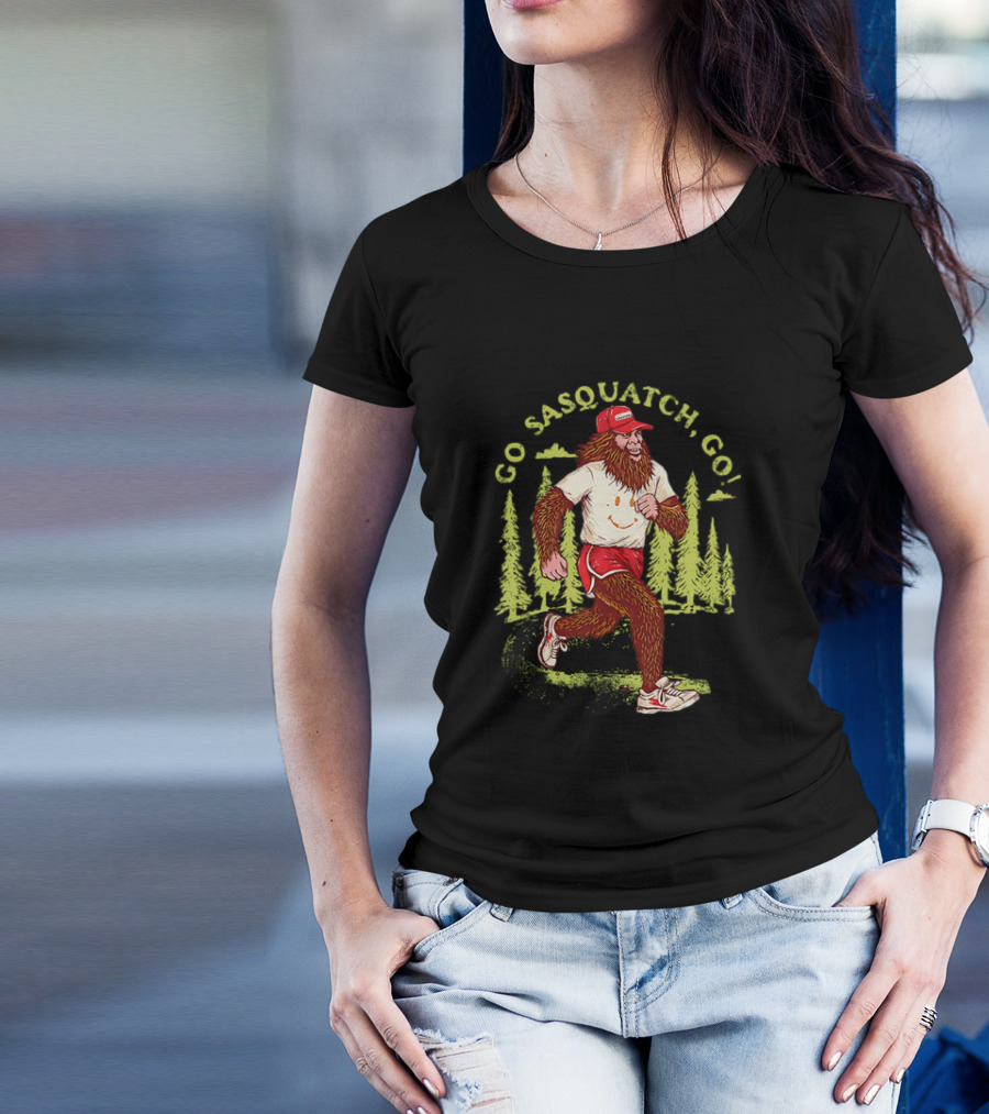 Go Sasquatch Go Bigfoot Jogging In Forest With Red Cap And Sneakers T-Shirt