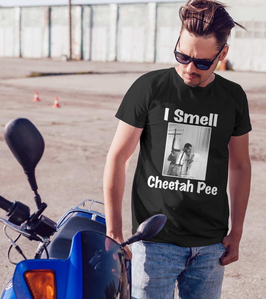 I Smell Cheetah Pee Man Holding Gun By Window T-Shirt