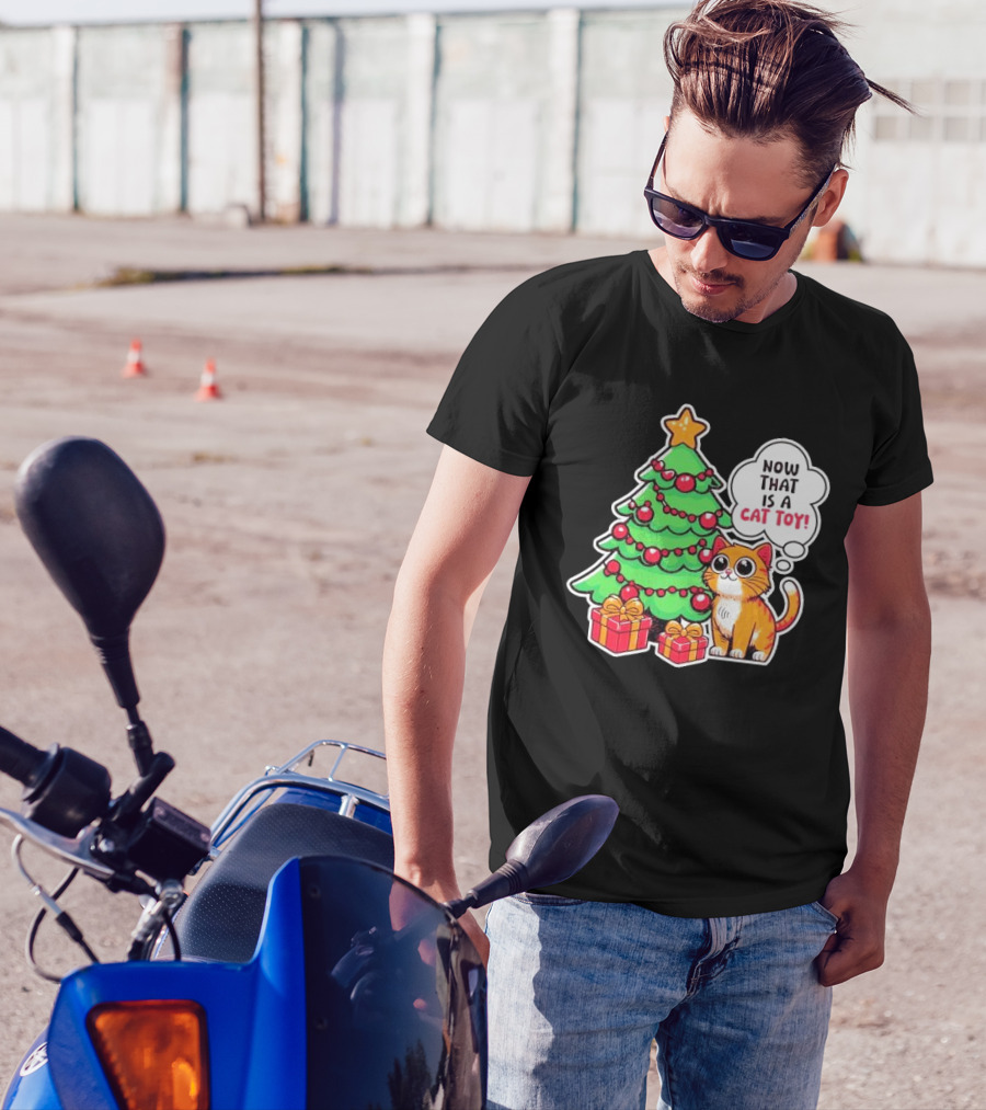 Now That Is A Cat Toy A Cute Orange Cat With Wide Eyes Next To Decorated Christmas Tree T-Shirt